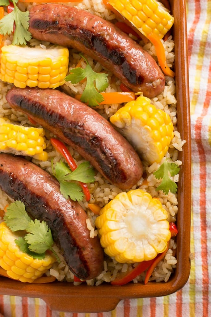 This sausage and rice bake is full of summer vegetables and is a complete meal in one pot!