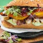 This updated club sandwich includes lemon herb grilled chicken, homemade avocado ranch spread, plenty of bacon and lots of summer tomatoes.