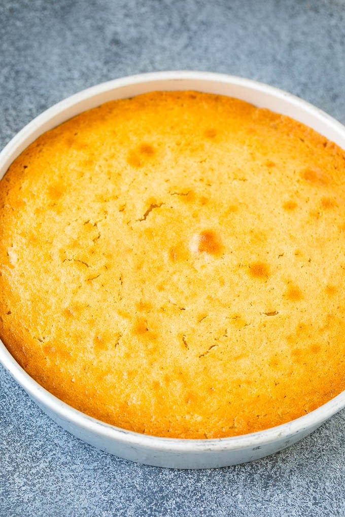 A baked cake inside a pan.