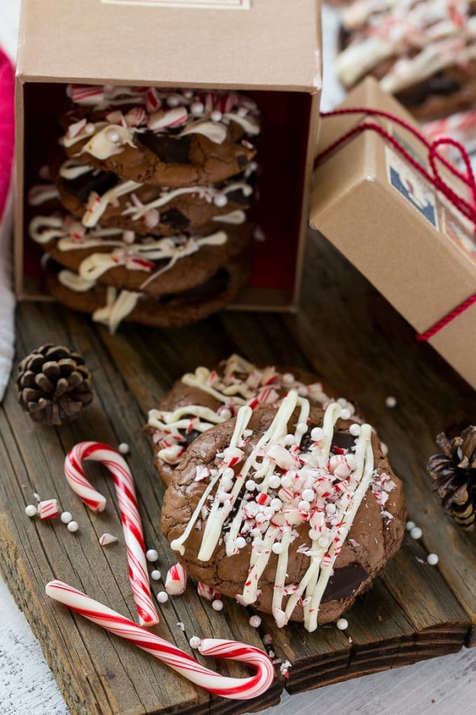 Peppermint Bark Cookie | Easy Peppermint Bark Cookies | Christmas Cookies | Peppermint Bark Cookies | Chocolate Peppermint Cookie #peppermint #peppermintbark #cookies #christmas #holiday #dessert #edsug Chocolate Peppermint Cookies topped with crushed candy canes in a gift box.