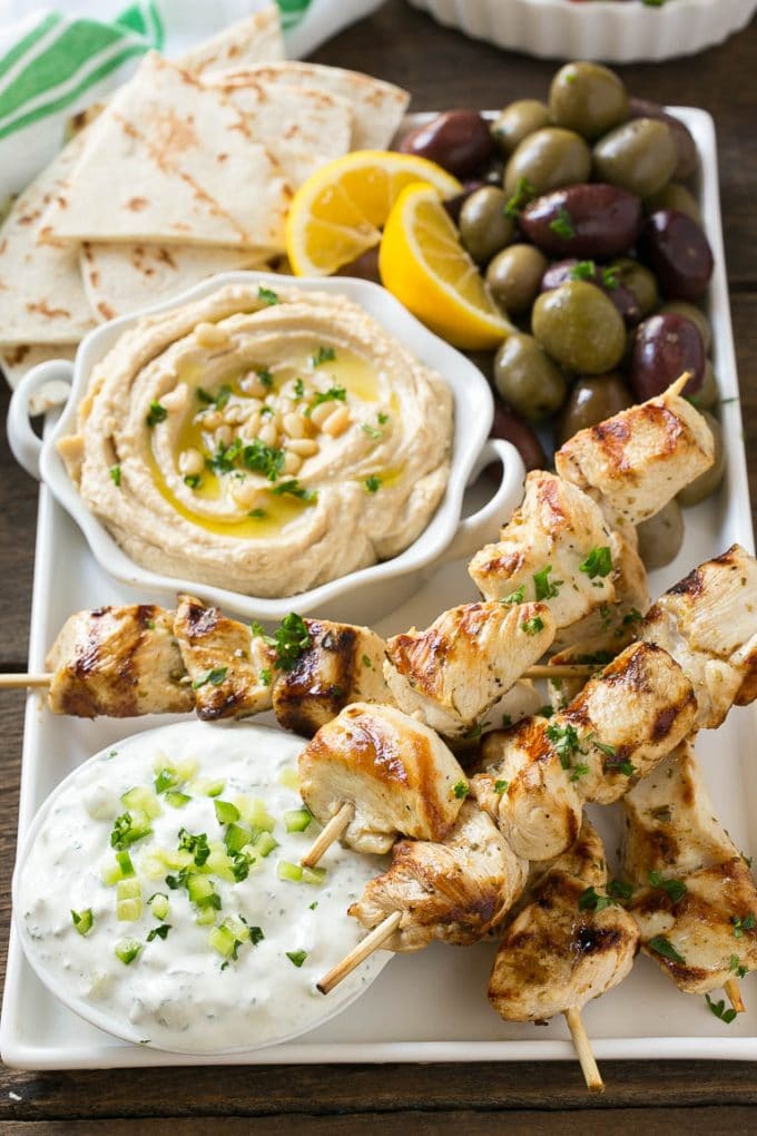 Greek Chicken Souvlaki Recipe | Easy Greek Chicken | Chicken Souvlaki | Greek Chicken Skewers | Easy Greek Chicken Skewers #chicken #kabobs #glutenfree #keto #lowcarb #grilling #edsug Chicken souvlaki skewers marinated in lemon and herbs, then grilled. Served with olives, hummus and pita bread.