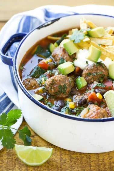 This recipe for mexican meatball soup is loaded with seasoned beef meatballs, black beans and plenty of vegetables in a flavorful and spicy broth. Add your favorite toppings and you've got a complete meal in a bowl!