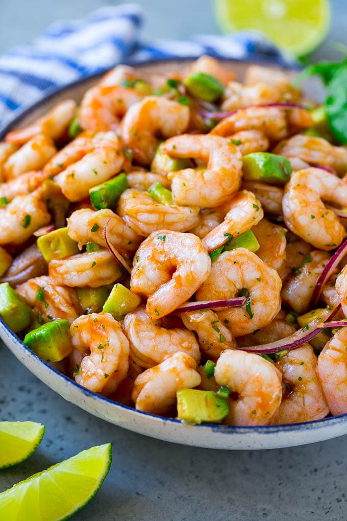 Mexican Shrimp Cocktail Recipe | Coctel de Camarones | Shrimp Cocktail | Mexican Shrimp #shrimp #appetizer #avocado #mexican #edsug A serving bowl of Mexican shrimp cocktail which contains small shrimp, diced avocado, herbs and jalapeno.