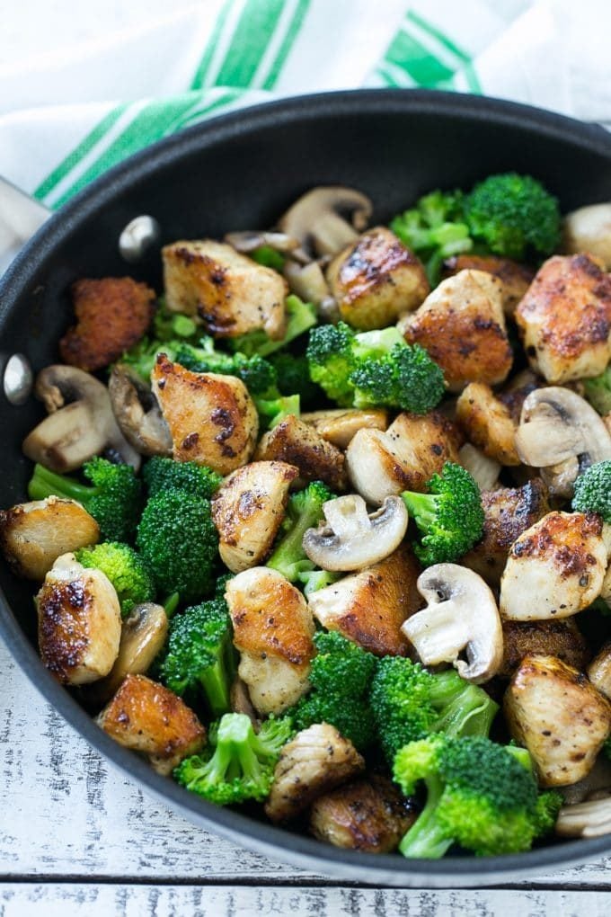 Chicken and Broccoli Stir Fry Recipe | Chicken Stir Fry | Healthy Chicken Recipe | Chicken and Broccoli | Chinese Food #chicken #broccoli #stirfry #healthy #cleaneating #dinner #edsug Sauteed chicken pieces, broccoli florets and mushrooms in a pan.