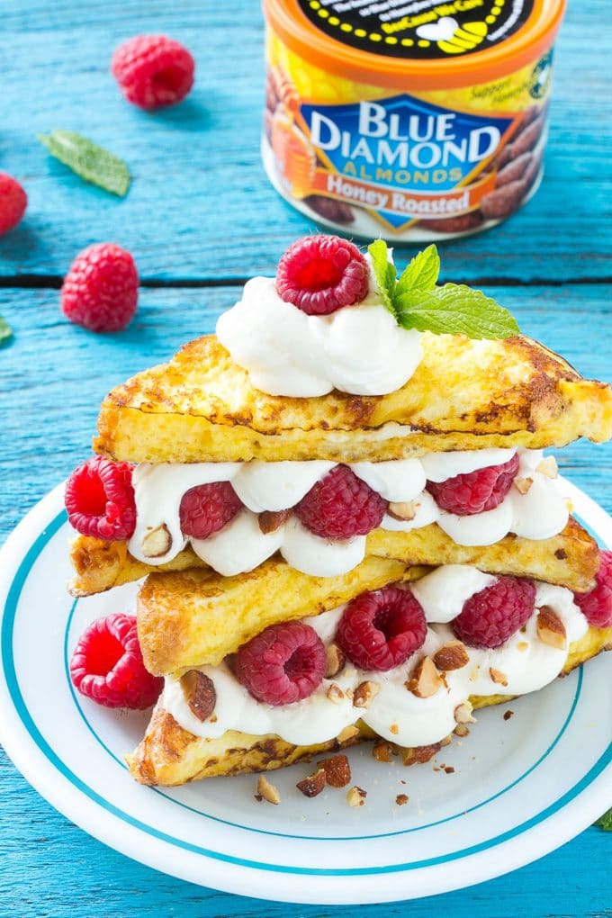 Stuffed French Toast | Cream Cheese Stuffed French Toast | French Toast Recipe #frenchtoast #raspberry #creamcheese #breakfast #brunch #edsug French toast filled with cream cheese and raspberries, then topped with maple syrup.