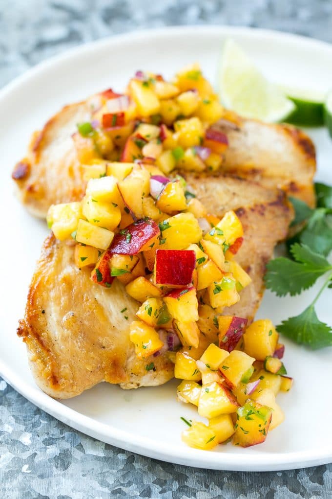 Peach Salsa | Fruit Salsa #peaches #salsa #dip #appetizer #edsug Peach salsa served over grilled chicken breast.