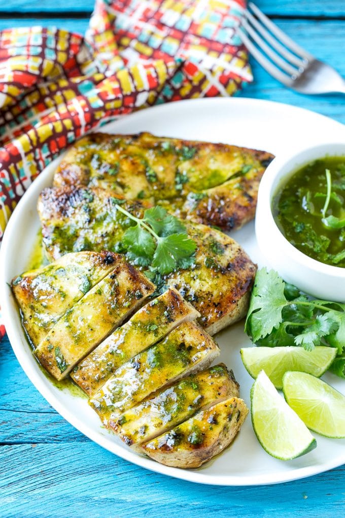 Cilantro Lime Chicken | Grilled Chicken #chicken #grilling #cilantro #lime #dinner #edsug Sliced cilantro lime chicken on a serving plate.