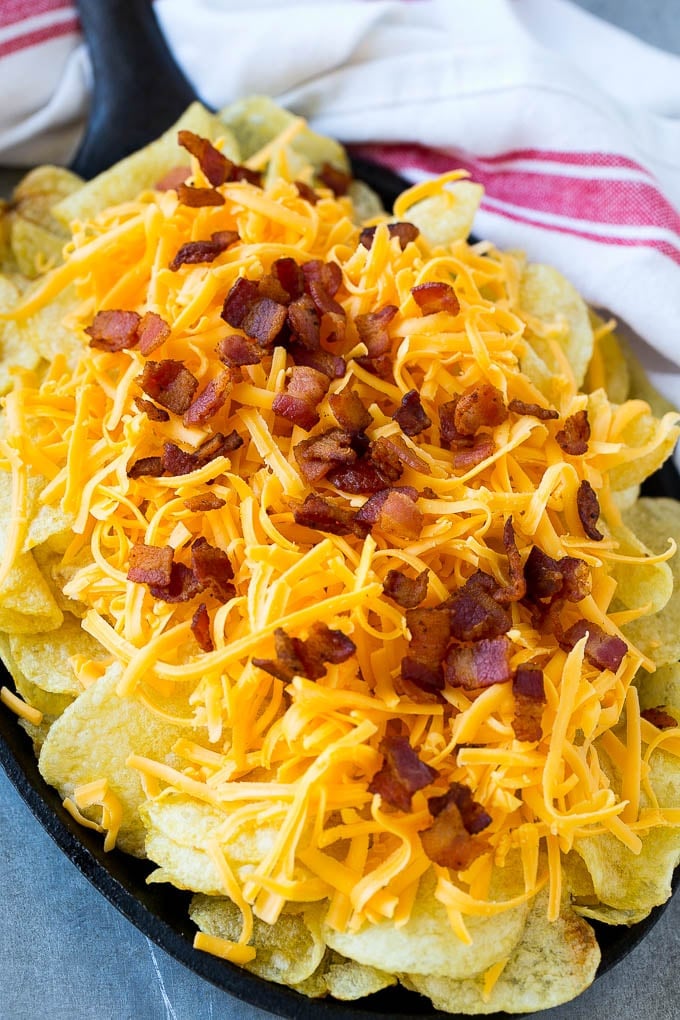 Irish Nachos Recipe | Potato Nachos | Potato Chip Recipe | Appetizer Recipe #nachos #potatoes #cheese #bacon #appetizer #edsug Kettle chips topped with shredded cheese and bacon.