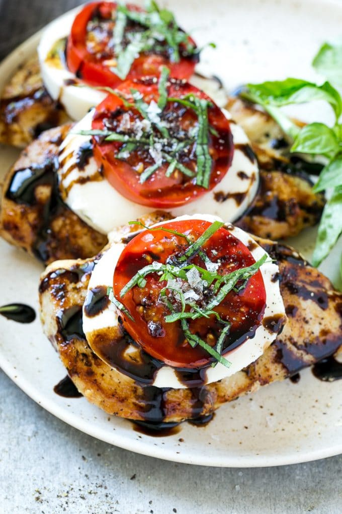 Chicken Caprese Recipe | Grilled Chicken #chicken #caprese #grilling #dinner #tomato #basil #edsug Chicken caprese with sliced tomatoes, balsamic glaze, fresh mozzarella and shredded basil.