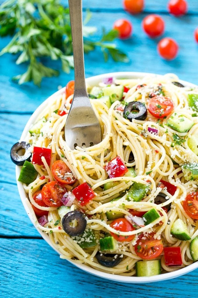 Spaghetti Salad Recipe | Pasta Salad | Potluck Recipe | Easy Pasta Salad #spaghetti #pasta #salad #edsug A bowl of spaghetti salad with a serving fork in it.
