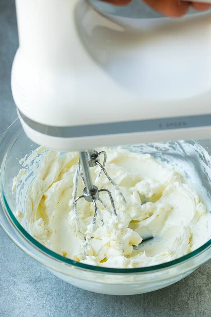 Cream Cheese Fruit Dip | Fruit Recipe | Fruit Dip #fruit #dip #creamcheese #snack #dessert #edsug A mixer whipping up cream cheese for fruit dip.