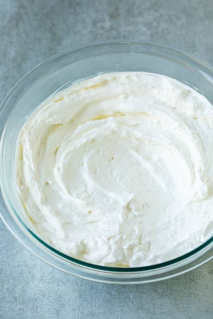 Cream Cheese Fruit Dip | Fruit Recipe | Fruit Dip #fruit #dip #creamcheese #snack #dessert #edsug Cream cheese, marshmallow cream and whipped topping in a mixing bowl.