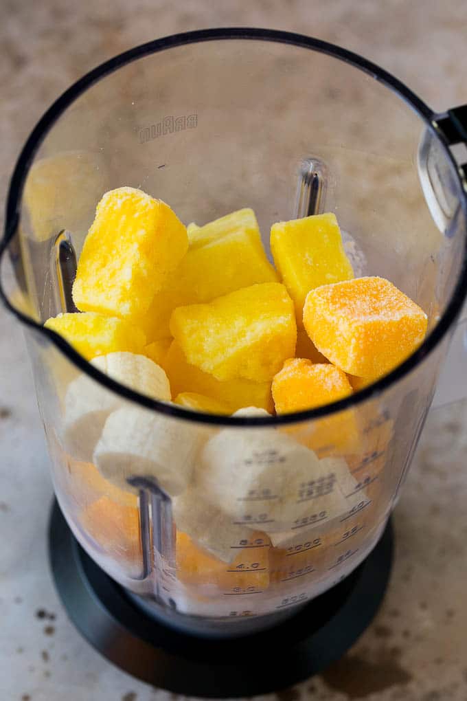 Tropical Smoothie Recipe | Mango Smoothie | Pineapple Smoothie #smoothie #mango #pineapple #banana #drink #edsug Pineapple, mango, banana and coconut milk in a blender.