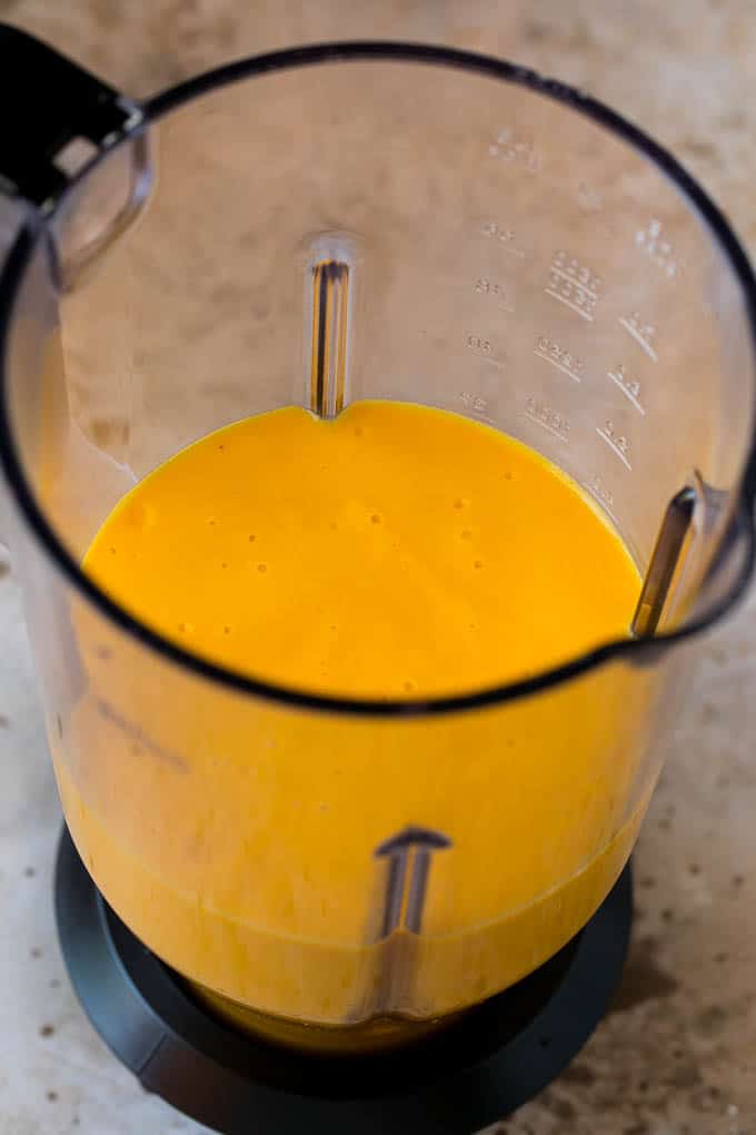 Tropical Smoothie Recipe | Mango Smoothie | Pineapple Smoothie #smoothie #mango #pineapple #banana #drink #edsug A smoothie inside of a blender.