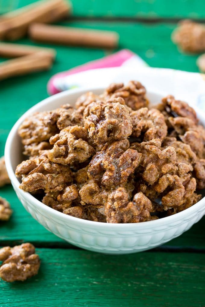 Candied Walnuts Recipe | Candied Nuts | Glazed Walnuts | Cinnamon Sugar Walnuts #walnuts #dessert #snack #edsug A white bowl filled with candied walnuts.