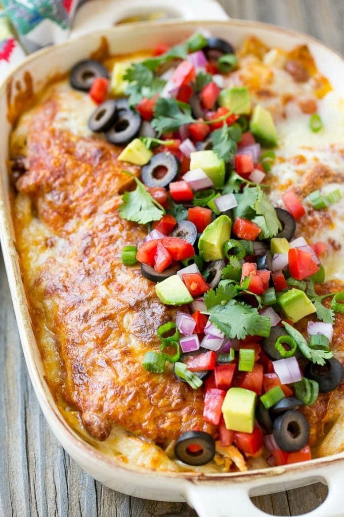Chicken Enchilada Casserole Recipe | Chicken Enchiladas | Easy Casserole Recipe | Enchilada Casserole #chicken #casserole #enchiladas #cheese #beans #dinner #edsug Chicken enchilada casserole topped with avocado, tomatoes and olives.