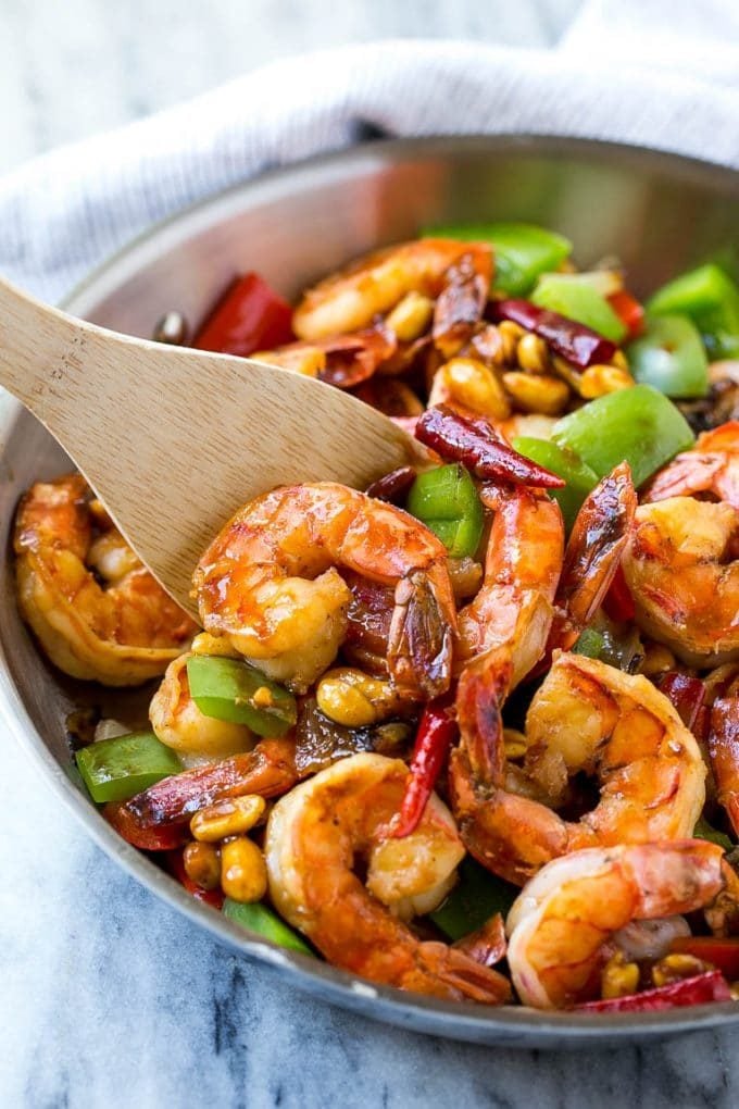 Kung Pao Shrimp | Shrimp Recipe | Shrimp Stir Fry | Easy Shrimp Recipe #shrimp #stirfry #peppers #dinner #edsug #spicy A serving spatula in a pan of Kung Pao shrimp.