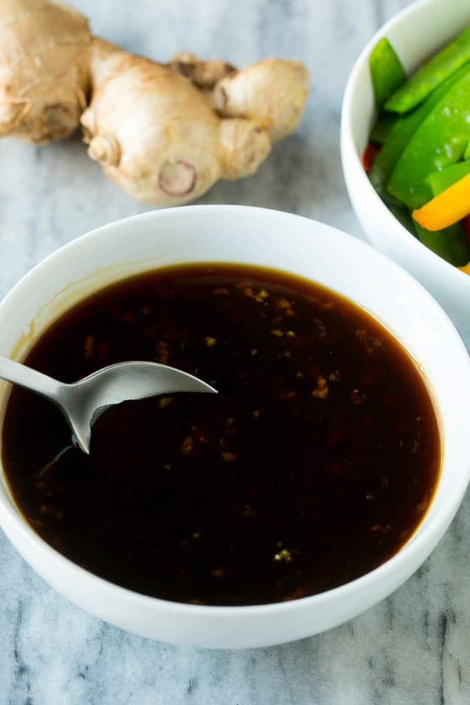 Teriyaki Shrimp Stir Fry Recipe | Shrimp Stir Fry | Healthy Stir Fry #shrimp #teriyaki #vegetables #stirfry #dinner #edsug A bowl of homemade teriyaki sauce with a spoon in it.