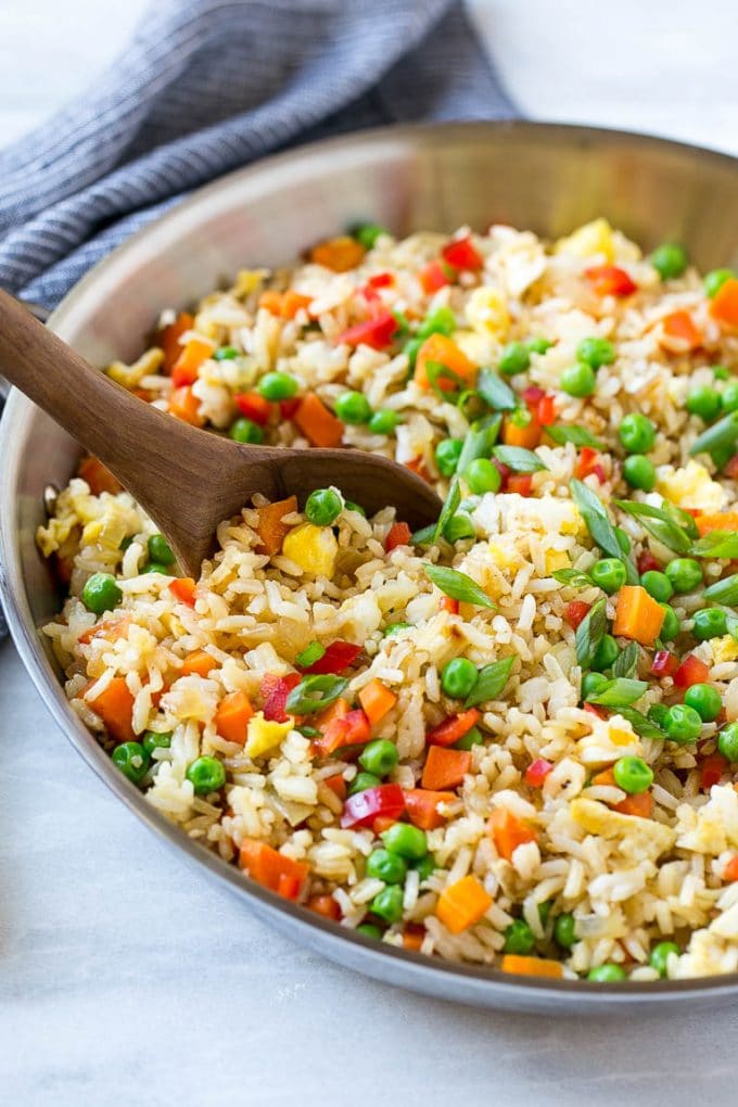 Veggie Fried Rice Recipe | Vegetarian Fried Rice | Easy Fried Rice Recipe | Chinese Food #rice #friedrice #veggie #vegetarian #sidedish #edsug Veggie fried rice in a skillet with a serving spoon.