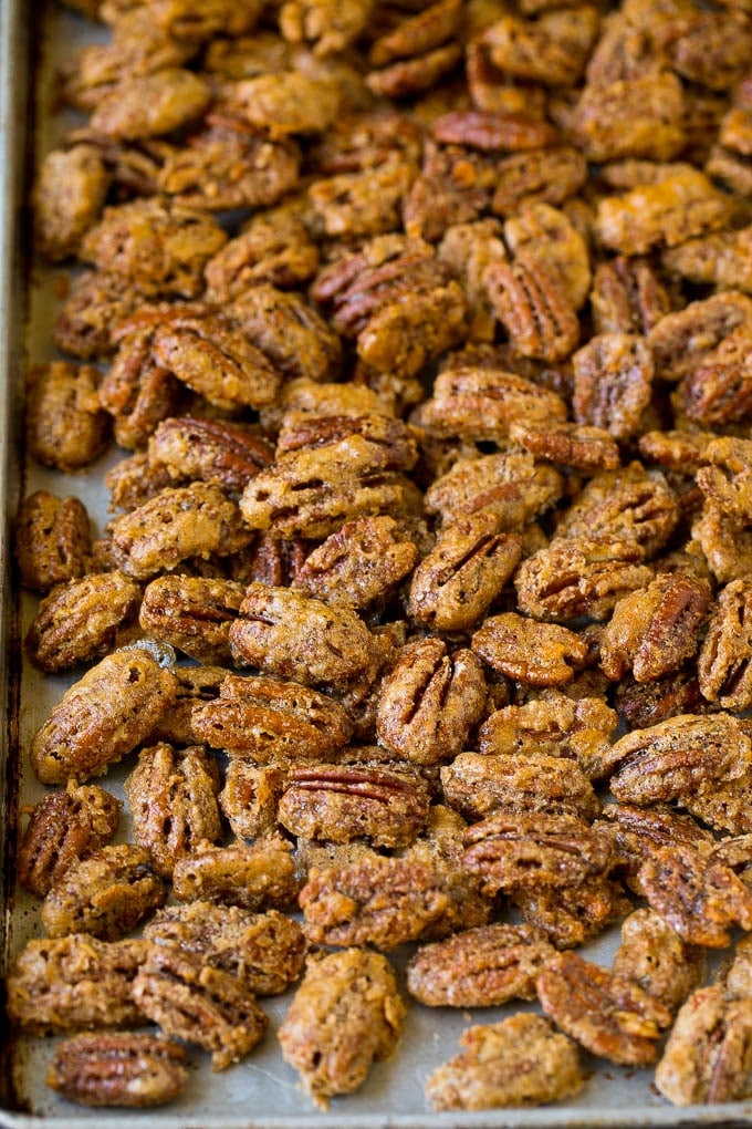 Candied Pecans Recipe | Glazed Pecans | Sugared Pecans #pecans #nuts #snack #dessert #edsug Cooked glazed nuts on a sheet pan.