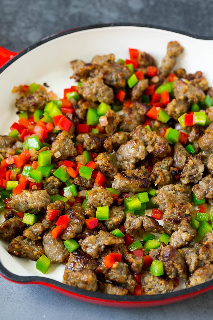 Sweet Potato Hash #sweetpotato #sausage #breakfast #brunch #edsug Sausage, onions and bell peppers in a skillet.