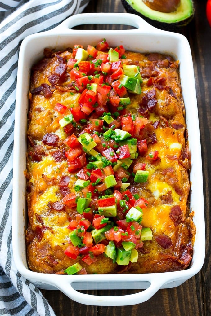 Breakfast Casserole with Bacon Recipe | Bacon and Egg Casserole | Egg Casserole with Bacon | Bacon Breakfast Casserole #eggs #bacon #casserole #breakfast #brunch #edsug A breakfast casserole with bacon that is topped with avocado and tomato.