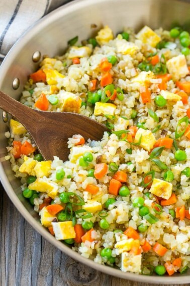 This cauliflower fried rice has all the flavors of your favorite take out dish, but without the carbs; the perfect healthier side dish!