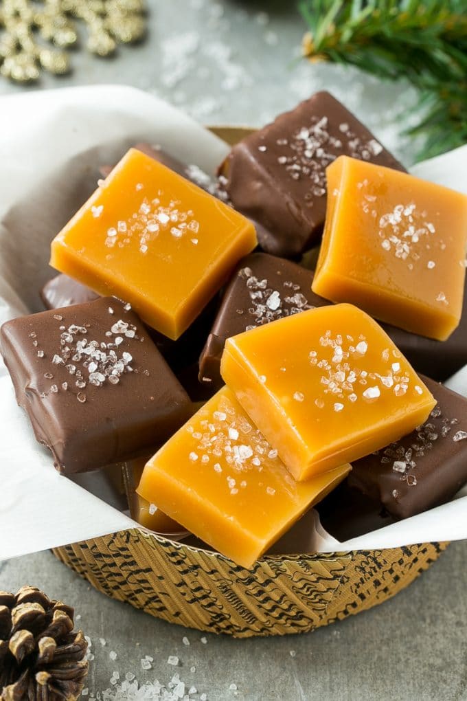 Microwave Caramels with Sea Salt Recipe | Homemade Caramels | Sea Salt Caramel | Homemade Candy #candy #caramels #caramel #microwavecaramels #homemade #dessert #edsug A basket of microwave caramels topped with sea salt.