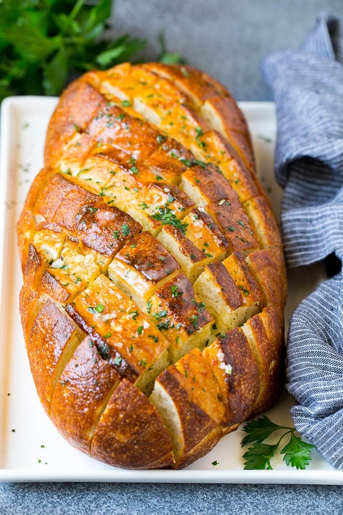 Pull Apart Bread | Garlic Bread | Cheese Bread #bread #garlic #cheese #sidedish #appetizer #edsug Baked garlic pull apart bread garnished with parsley.