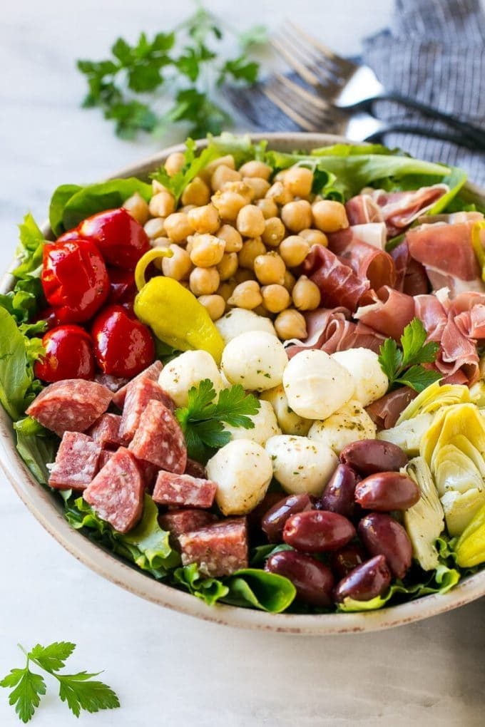 Antipasto Salad Recipe | Italian Salad | Main Course Salad | Antipasto Recipe #salad #salami #italianfood #dinner #lunch #edsug Antipasto salad with cured meats, fresh mozzarella cheese and roasted peppers over salad greens.