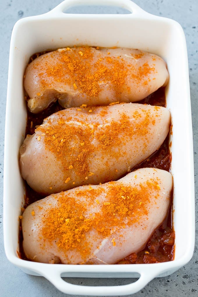 Salsa Chicken Recipe | Baked Chicken | Mexican Chicken #chicken #salsa #mexican #lowcarb #keto #glutenfree #dinner #edsug Poultry in a baking dish topped with taco seasoning.