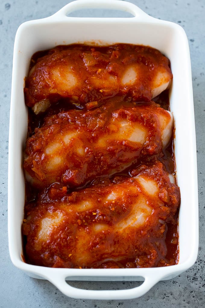 Salsa Chicken Recipe | Baked Chicken | Mexican Chicken #chicken #salsa #mexican #lowcarb #keto #glutenfree #dinner #edsug Chicken breasts in a baking dish coated with salsa.