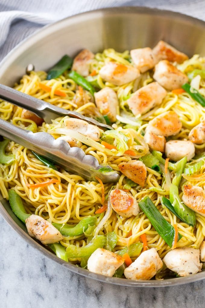 Chicken Chow Mein Recipe | Easy Chicken Recipe | Chow Mein | Chinese Food #chowmein #takeout #asianfood #edsug A pan of chicken chow mein with serving tongs in it.