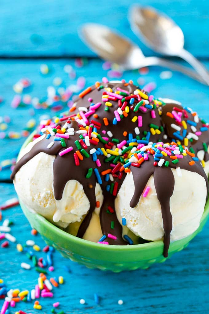 Homemade Magic Shell Recipe | Chocolate Ice Cream Topping | Chocolate Sauce | Hard Chocolate Coating #chocolate #icecream #dessert #edsug Magic shell over scoops of ice cream, topped with rainbow sprinkles.