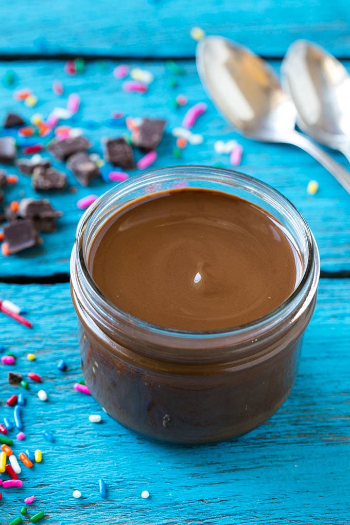 Homemade Magic Shell Recipe | Chocolate Ice Cream Topping | Chocolate Sauce | Hard Chocolate Coating #chocolate #icecream #dessert #edsug A jar of chocolate chocolate shell.