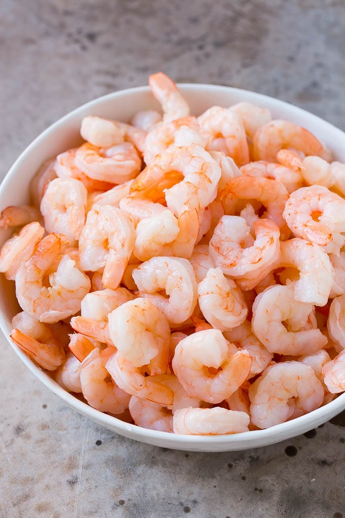 Shrimp Ceviche Recipe | Mexican Shrimp | Marinated Shrimp #shrimp #ceviche #cleaneating #healthy #lowcarb #keto #glutenfree #dinner #appetizer #edsug Cooked prawns in a serving bowl.