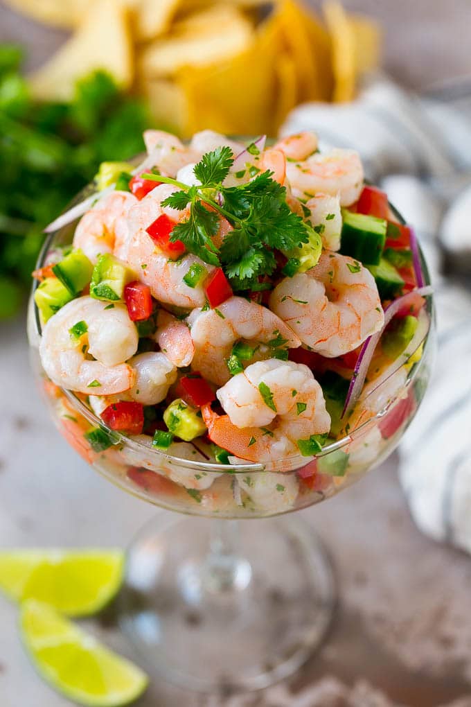 Shrimp Ceviche Recipe | Mexican Shrimp | Marinated Shrimp #shrimp #ceviche #cleaneating #healthy #lowcarb #keto #glutenfree #dinner #appetizer #edsug Shrimp ceviche in a serving cup garnished with cilantro.