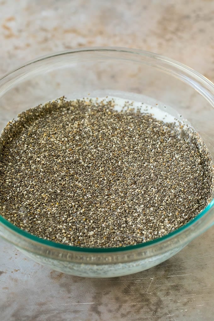 Chia seeds and coconut milk in a bowl.