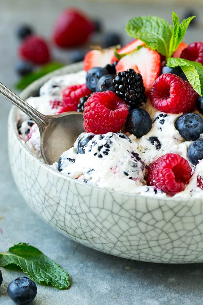 Berry Cheesecake Salad Recipe | Fruit Salad | Berry Fruit Salad | Cheesecake Salad #salad #cheesecake #fruit #berries #sidedish #dessert #edsug Berry cheesecake salad in a bowl garnished with fresh berries and mint.