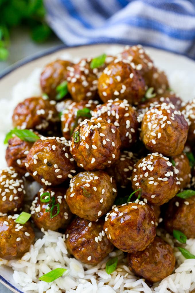 Teriyaki Meatballs Recipe | Asian Meatballs Recipe | Easy Meatball Recipe | Appetizer Meatballs #meatballs #teriyaki #beef #rice #dinner #edsug Meatballs topped with homemade sauce and sesame seeds.