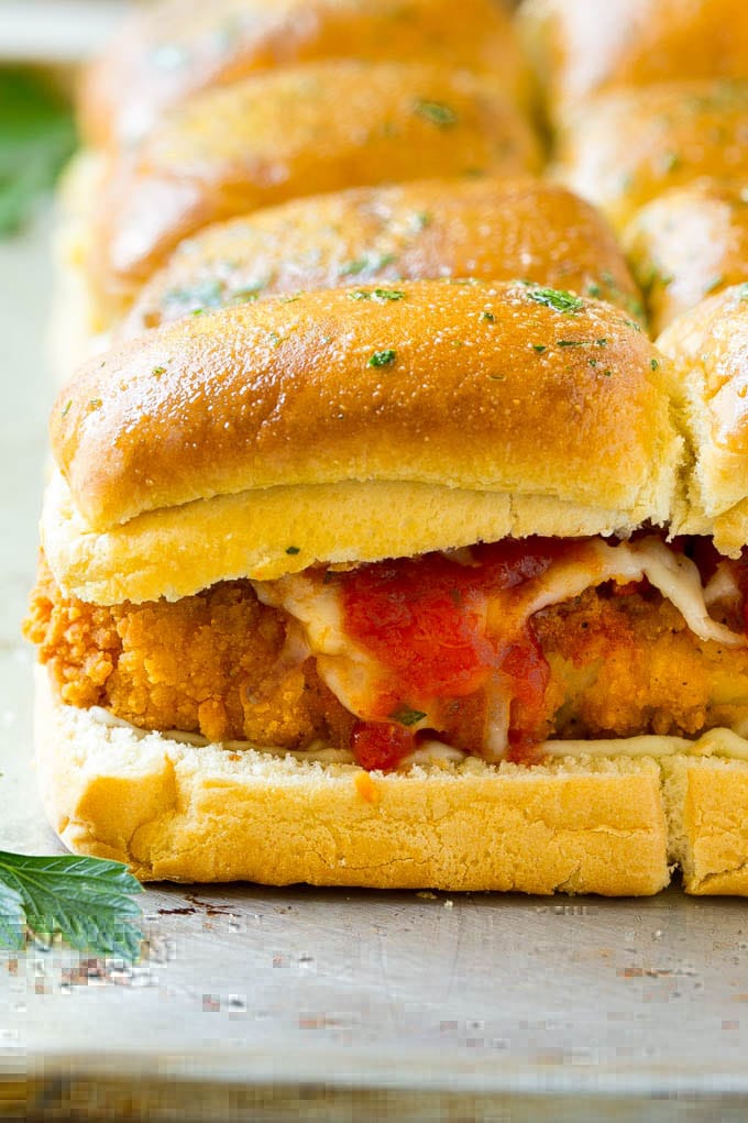 Chicken Parmesan Sliders | Chicken Parmesan Sandwich Recipe | Slider Sandwich Recipe #sliders #chickenparm #chickenparmesan #chickenparmesansliders #dinner #appetizer #edsug Crispy chicken with tomato sauce and cheese on slider buns.