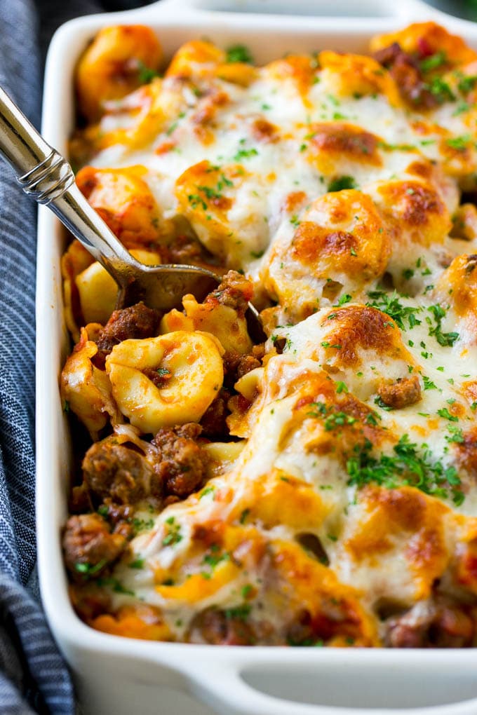 Baked Tortellini with Meat Sauce Recipe | Cheese Tortellini | Tortellini Recipe | Baked Pasta Recipe #tortellini #bakedtortellini #meatsauce #pasta #dinner #edsug A pan of baked tortellini in a meat sauce, all covered with cheese.