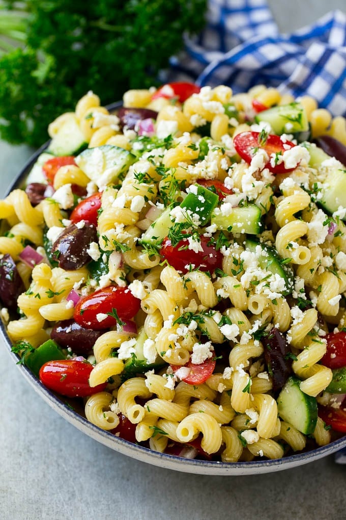Greek Pasta Salad | Easy Pasta Salad | Vegetable Pasta Salad #pasta #salad #greek #cucumber #tomato #vegetarian #dinner #edsug Greek pasta salad in a serving bowl, garnished with parsley.