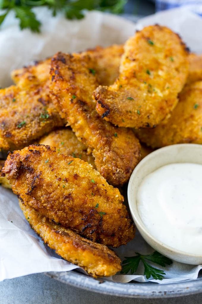 Baked Fried Chicken Recipe | Oven Fried Chicken | Baked Chicken Fingers | Crispy Chicken Fingers #chicken #friedchicken #bakedchicken #ovenfriedchicken #chickenfingers #dinner #edsug Crispy baked fried chicken fingers on a plate with ranch dip.