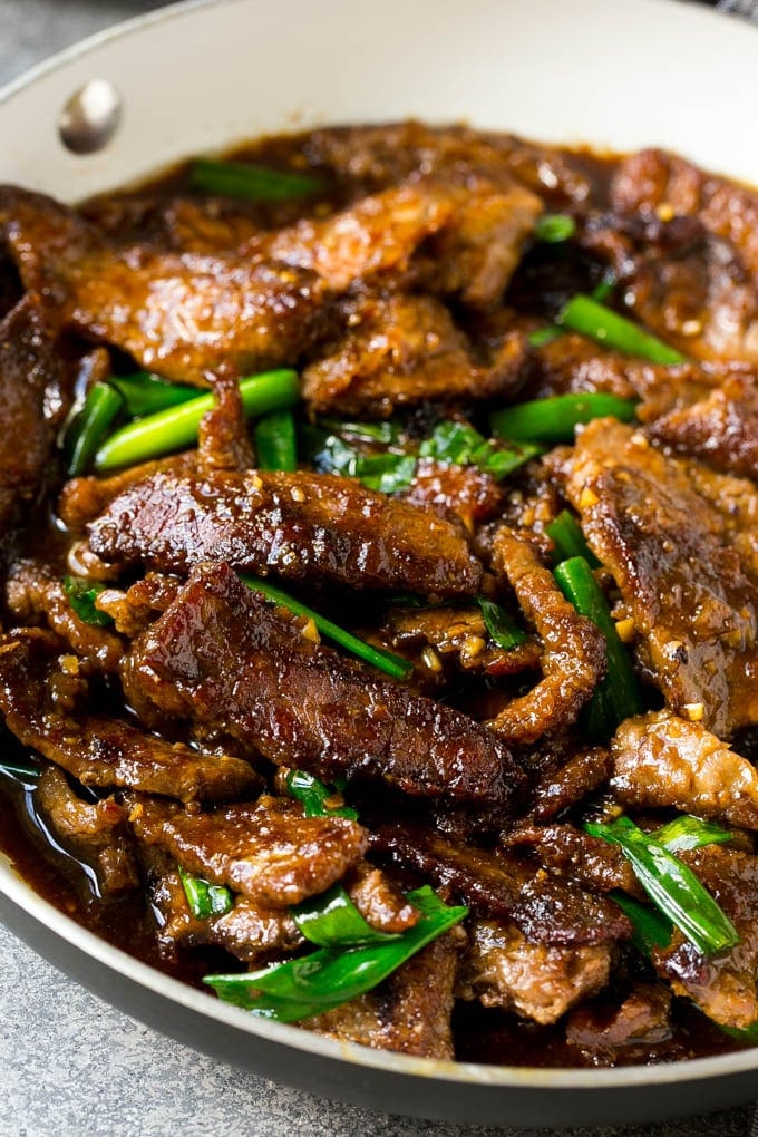 Mongolian Beef Recipe | Asian Beef Recipe | Chinese Beef | Beef Stir Fry #Chinese #Mongolian #Asian #mongolianbeef #beef #edsug #dinner A pan full of Mongolian beef with green onions.