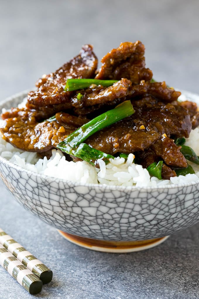 Mongolian Beef Recipe | Asian Beef Recipe | Chinese Beef | Beef Stir Fry #Chinese #Mongolian #Asian #mongolianbeef #beef #edsug #dinner A bowl of mongolian beef over rice.