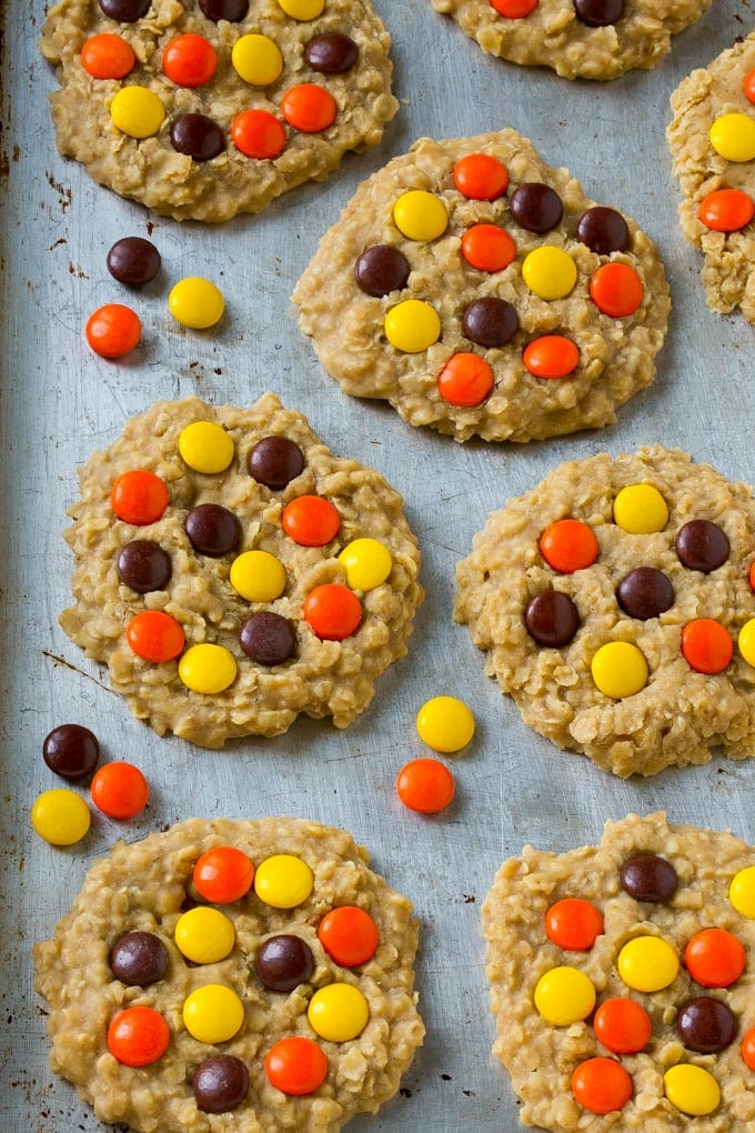 No Bake Peanut Butter Cookies Recipe | No Bake Cookies | Peanut Butter Cookies #peanutbutter #cookies #nobake #nobakecookies #peanutbuttercookies #dessert #edsug A sheet pan full of cookies with candies on top.