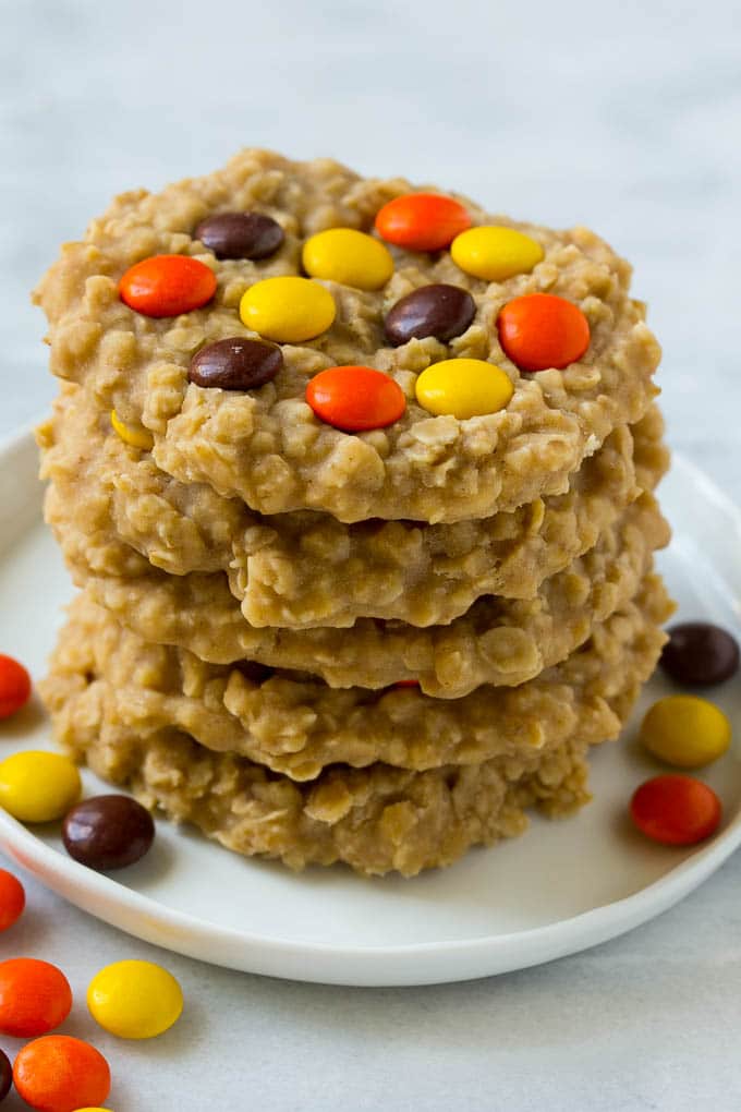 No Bake Peanut Butter Cookies Recipe | No Bake Cookies | Peanut Butter Cookies #peanutbutter #cookies #nobake #nobakecookies #peanutbuttercookies #dessert #edsug A plate with a stack of no bake peanut butter cookies.