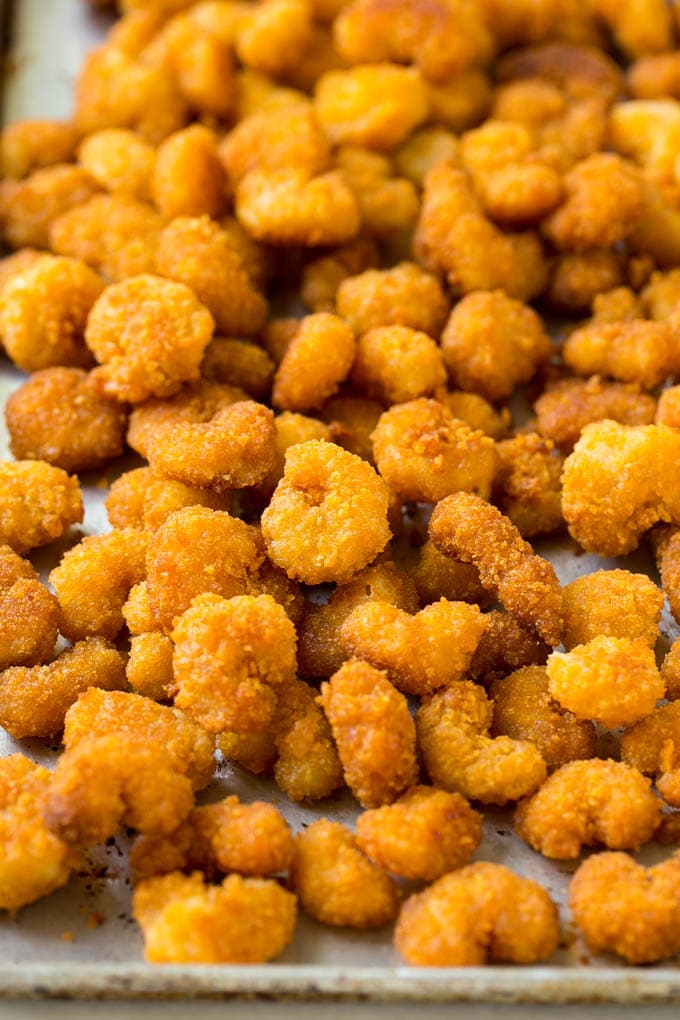 Sesame Shrimp Recipe | Crispy Shrimp | Popcorn Shrimp | Asian Shrimp | Easy Shrimp Recipe #shrimp #fried #friedshrimp #sesameshrimp #crispy #popcornshrimp #chinese #asian #dinner #edsug A pan of cooked popcorn shrimp.