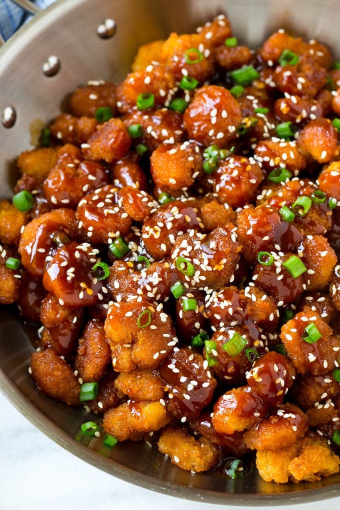Sesame Shrimp Recipe | Crispy Shrimp | Popcorn Shrimp | Asian Shrimp | Easy Shrimp Recipe #shrimp #fried #friedshrimp #sesameshrimp #crispy #popcornshrimp #chinese #asian #dinner #edsug A pan of popcorn shrimp in an Asian sesame sauce.